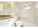 Updated bathroom with a bathtub, granite countertop, and tile shower surround at 3218 Ward Sw Dr, Atlanta, GA 30354