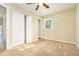 Bright bedroom featuring a ceiling fan, ample closet space, and neutral carpeting at 3218 Ward Sw Dr, Atlanta, GA 30354