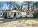 Ranch style home with brick facade, front door, and landscaped yard at 3218 Ward Sw Dr, Atlanta, GA 30354