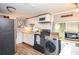 Galley kitchen with white cabinets and black appliances at 135 Marina Ct, Canton, GA 30114