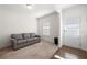 Living room with hardwood floors and a view of the front door at 1566 Ribbon Mill Sw Ln, Mableton, GA 30126