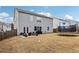 Large backyard with patio, furniture, grill, and trampoline at 251 Ivy Chase Loop, Dallas, GA 30157