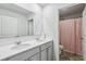 Clean bathroom with double vanity and a shower/tub combo at 251 Ivy Chase Loop, Dallas, GA 30157