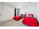 Twin bedroom featuring red accents, neutral carpet, and black out curtains at 251 Ivy Chase Loop, Dallas, GA 30157