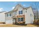 Charming two-story home with stone accents and a well-manicured lawn at 251 Ivy Chase Loop, Dallas, GA 30157