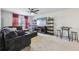 Relaxing game room featuring comfortable sectional sofa, media console, and a small game table at 251 Ivy Chase Loop, Dallas, GA 30157