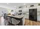 Modern kitchen with granite countertops, stainless steel appliances, and island seating at 251 Ivy Chase Loop, Dallas, GA 30157
