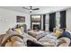 Comfortable living room with a fireplace, TV, ceiling fan, and modern decor at 251 Ivy Chase Loop, Dallas, GA 30157