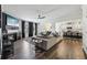 Open-concept living space with a fireplace, large sectional sofa, and views into the kitchen at 251 Ivy Chase Loop, Dallas, GA 30157