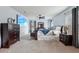 Spacious main bedroom featuring a ceiling fan, large TV, and neutral carpet at 251 Ivy Chase Loop, Dallas, GA 30157