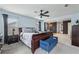 Bright main bedroom showcasing a ceiling fan and a sitting area at 251 Ivy Chase Loop, Dallas, GA 30157