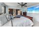 Main bedroom view featuring a large TV, ceiling fan, and sitting area at 251 Ivy Chase Loop, Dallas, GA 30157