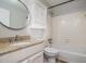 Bathroom features granite countertops, a round mirror and a shower and tub combination at 2901 Lenox Ne Rd # 506, Atlanta, GA 30324