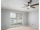 Bedroom featuring a ceiling fan and large window with natural light at 2901 Lenox Ne Rd # 506, Atlanta, GA 30324