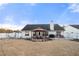 Home's backyard features a gazebo and patio at 2650 Hamilton Chase Run, Buford, GA 30519