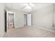 Neutral bedroom with carpet, white ceiling fan, and standard closet at 2650 Hamilton Chase Run, Buford, GA 30519