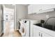 Bright laundry room with washer, dryer, and utility sink at 2650 Hamilton Chase Run, Buford, GA 30519