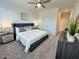 Comfortable bedroom featuring soft carpeting, neutral walls, and contemporary furnishings at 534 Sawnee Village Blvd # D65, Cumming, GA 30040