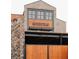 Modern building featuring the word 'Homestead' on wood siding and stonework at 534 Sawnee Village Blvd # D65, Cumming, GA 30040