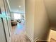 Hallway view leading to a living room with stylish decor, wood floors, and plenty of natural light at 534 Sawnee Village Blvd # D65, Cumming, GA 30040