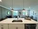 Well-equipped kitchen with stainless steel appliances, and a stylish pendant lighting and decor at 534 Sawnee Village Blvd # D65, Cumming, GA 30040