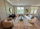 Bright living room features a curved sofa, modern decor, and neutral color palette, creating an inviting atmosphere at 534 Sawnee Village Blvd # D65, Cumming, GA 30040