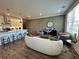 Open-concept living space with a modern kitchen, inviting seating, and stylish design details throughout at 534 Sawnee Village Blvd # D65, Cumming, GA 30040