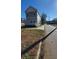 Side view of a two-story house on a residential street at 857 Proctor Nw St, Atlanta, GA 30314