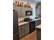 Modern kitchen with granite countertops and gray cabinets at 857 Proctor Nw St, Atlanta, GA 30314