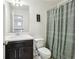 Clean bathroom with dark vanity and a patterned shower curtain at 1000 Belfry Ter, Fairburn, GA 30213