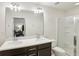 Double vanity bathroom with a large shower at 1000 Belfry Ter, Fairburn, GA 30213