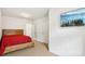 Bright bedroom with wood-look flooring and a mounted TV at 1000 Belfry Ter, Fairburn, GA 30213