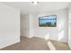 Well-lit bedroom featuring a large window and wall-mounted TV at 1000 Belfry Ter, Fairburn, GA 30213