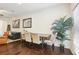 Dining area with table, chairs, and view into living room at 1000 Belfry Ter, Fairburn, GA 30213