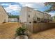 Tan townhome exterior with private fenced yard at 1000 Belfry Ter, Fairburn, GA 30213