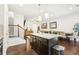 Kitchen with dark brown cabinets, granite countertops, and island with seating at 1000 Belfry Ter, Fairburn, GA 30213