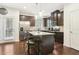 Kitchen with dark brown cabinets, granite countertops, and island with seating at 1000 Belfry Ter, Fairburn, GA 30213