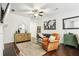 Living room with hardwood floors, leather chairs, and a world map print at 1000 Belfry Ter, Fairburn, GA 30213