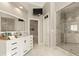 Elegant bathroom featuring a marble shower and modern vanity at 1211 Grand View Se Dr, Mableton, GA 30126