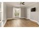 Light-filled bedroom featuring hardwood floors and a ceiling fan at 1211 Grand View Se Dr, Mableton, GA 30126