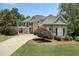 Two-story home with a brick facade and lush landscaping at 1211 Grand View Se Dr, Mableton, GA 30126