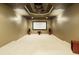 Finished basement home theater with large screen and surround sound at 1211 Grand View Se Dr, Mableton, GA 30126