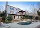 Two-story house with white siding, stone accents, and a pool at 1211 Grand View Se Dr, Mableton, GA 30126