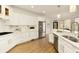 Modern kitchen with white cabinets, stainless steel appliances, and a large island at 1211 Grand View Se Dr, Mableton, GA 30126