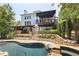 Inviting pool and spa area with a stone patio at 1211 Grand View Se Dr, Mableton, GA 30126