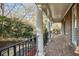 Brick porch with columns and wrought-iron railing at 1211 Grand View Se Dr, Mableton, GA 30126