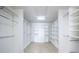 Spacious walk-in closet with ample shelving and hanging rods at 1211 Grand View Se Dr, Mableton, GA 30126