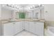 Bright bathroom featuring double sinks and corner vanity at 211 Colonial Homes Nw Dr # 1105, Atlanta, GA 30309