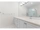 Bright bathroom featuring white cabinets with countertop, shower, and sleek chrome faucet at 211 Colonial Homes Nw Dr # 1105, Atlanta, GA 30309