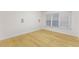 Bright, empty bedroom with hardwood floors and lots of natural light at 211 Colonial Homes Nw Dr # 1105, Atlanta, GA 30309